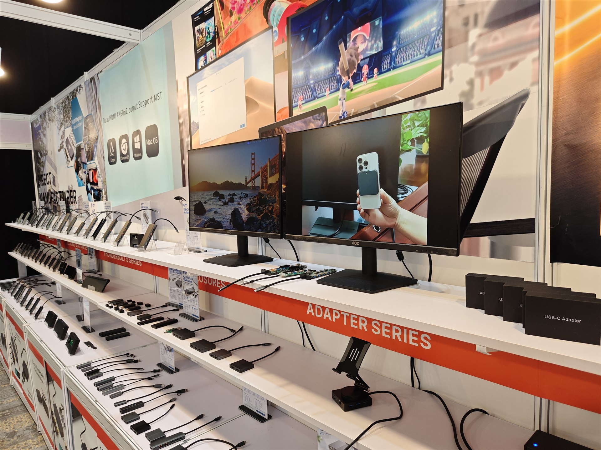 A close-up of docking stations, adapters, cables and display equipment at the Yuanshan booth